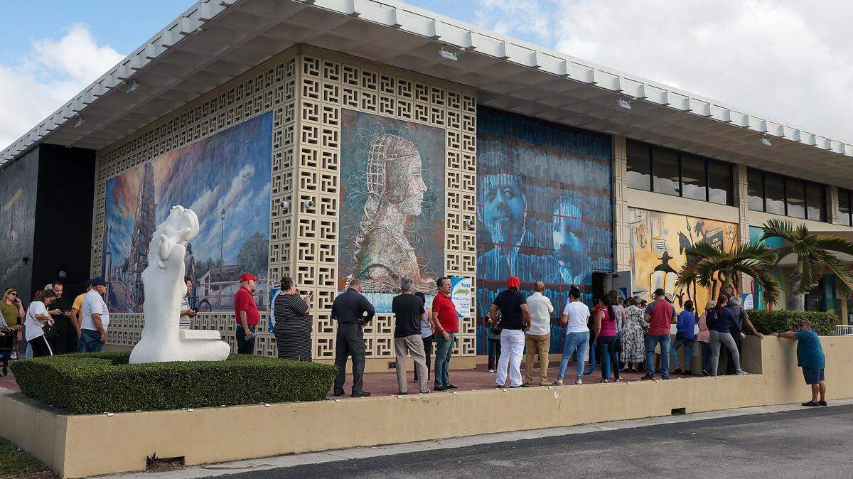 Hialeah residents stand in line as they and cast their ballots at the John F. Kennedy Library in Hialeah, Florida on Tuesday, November 8, 2022.