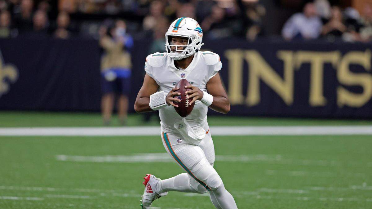 Miami Dolphins quarterback Tua Tagovailoa (1) looks to throw a pass against the New Orleans Saints during the first half of an NFL football game Monday, Dec. 27, 2021, in New Orleans. (AP Photo/Butch Dill)