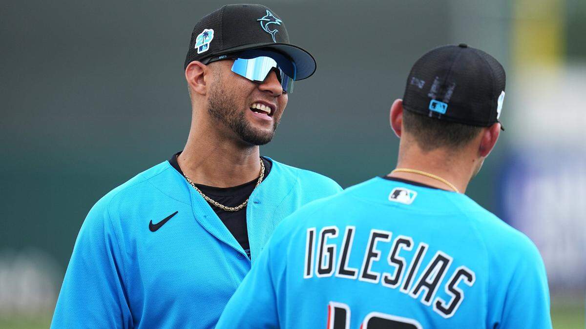Miami Marlins designated hitter Yuli Gurriel (97) talks with shortstop Jose Iglesias (13) before the game against the New York Mets at Roger Dean Stadium in Jupiter, Florida, on Monday, March 13, 2023.