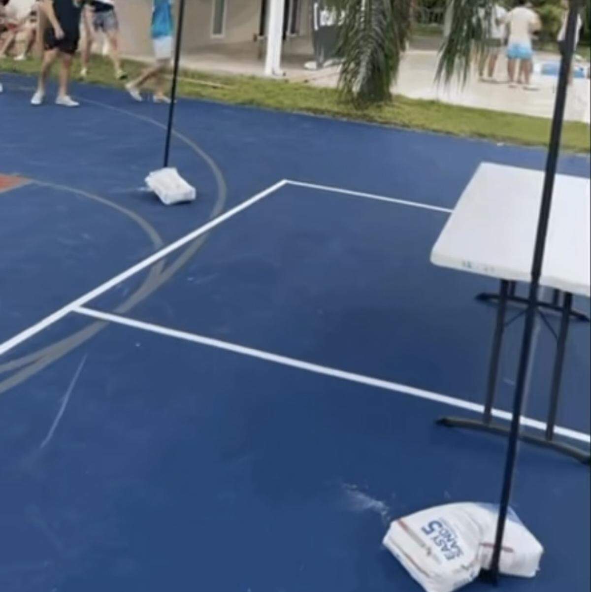 Photos that show Easy Sand 5 sandbags filled with a patching compound were used to secure tent poles and to set up a volleyball court at the Oct. 1 pool party held by Sigma Phi Epsilon at an off-campus home about 15 blocks west of the Coral Gables campus of the University of Miami.