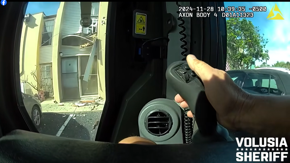 A ramming device was used by deputies to punch holes in the front of the condominium after calls to surrender were met with gunfire, video shows.