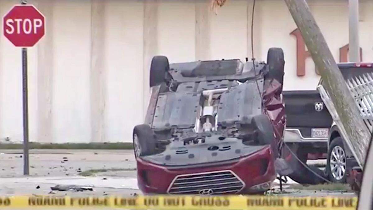A woman was killed and three police officers were injured, and four robbery suspects are in custody after a Sunday afternoon crash at Northwest 58th Street and 17th Avenue.