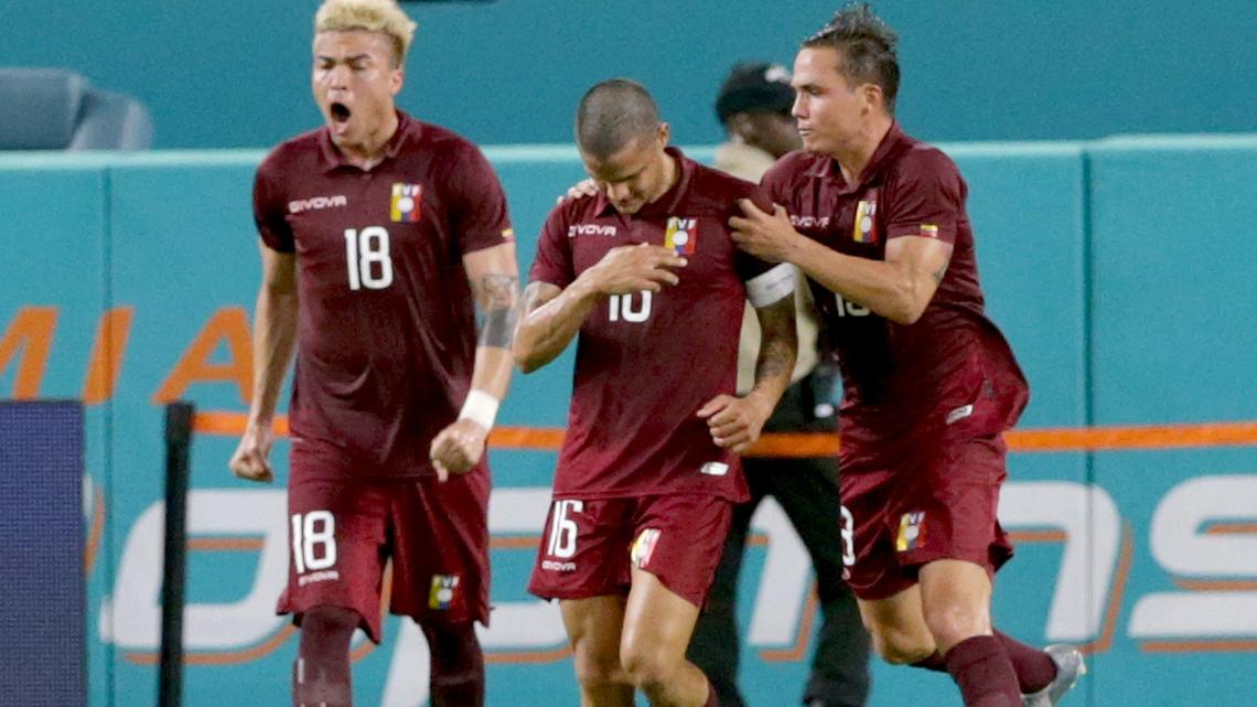 Venezuelans Adalberto Pe–aranda (far left) and Jhon Murillo, celebrate Roberto Rosales #16, goal during the first half of a friendly match between Venezuela and Ecuador at Hardrock Stadium in Miami Gardens on Saturday, June 01, 2019.
