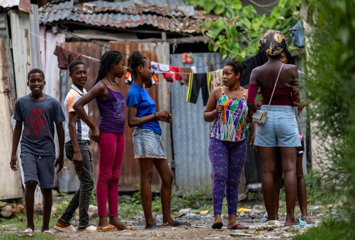 Young people mingle at a displacement camp in Leogane, Haiti. Children area among large number of Haitians who have been forced from their homes by armed gangs.