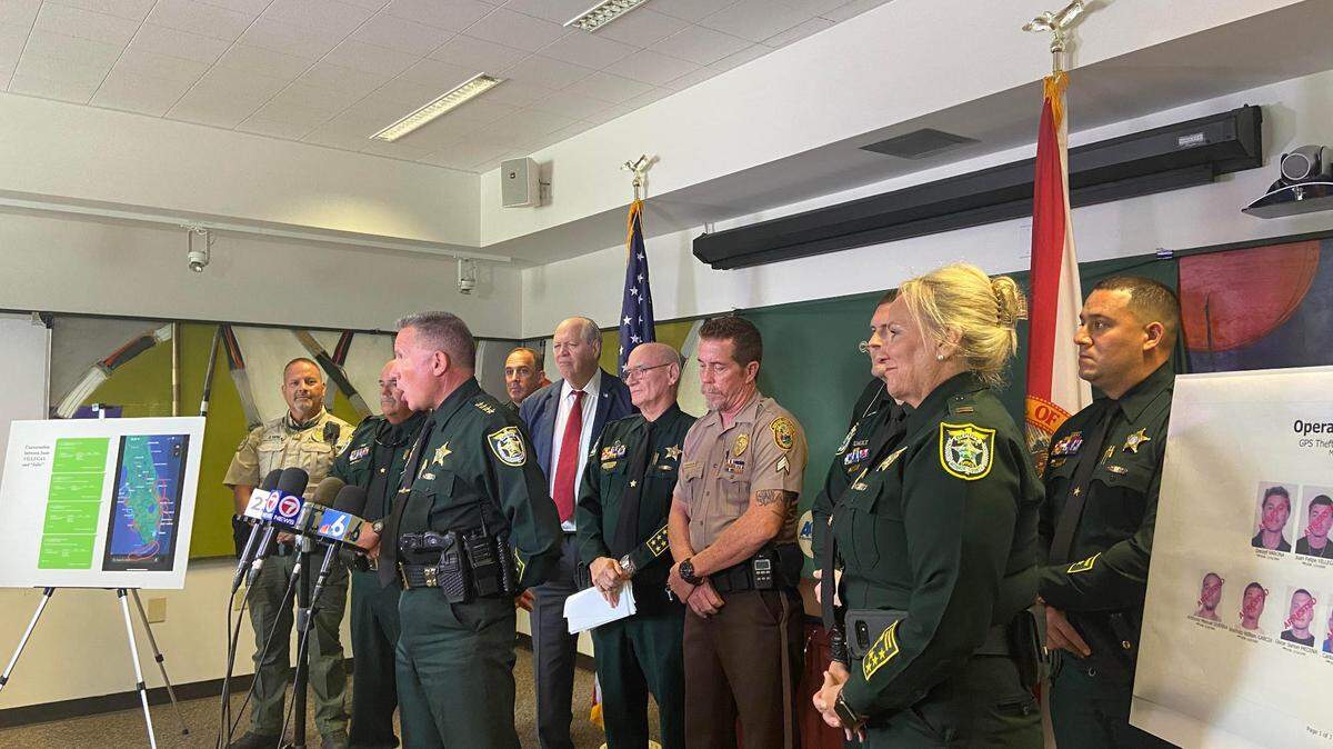 Monroe County Sheriff Rick Ramsay, backed by leadership of other Florida police agencies, briefs reporters Wednesday, Aug. 23, 2023, about a large GPS theft ring that he said operated throughout the state.