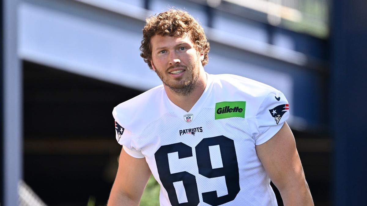 Jul 23, 2025; Foxborough, MA, USA; New England Patriots guard Cole Strange (69) walks to the practice field for training camp at Gillette Stadium. Mandatory Credit: Eric Canha-Imagn Images