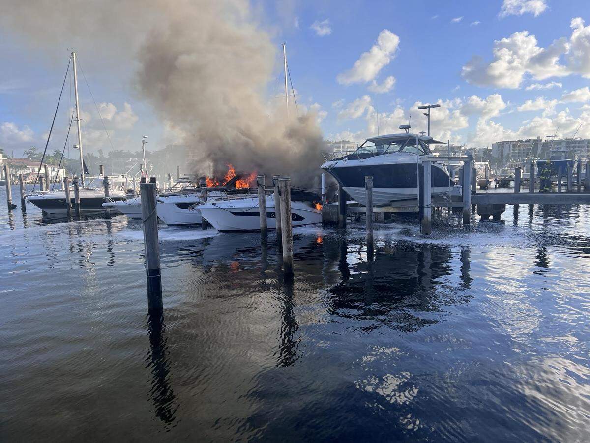 Miami Fire Rescue battled a boat fire at a Grove Isle dock Tuesday morning, June 17, 2025. Two boats were engulfed in flames and damaged two other boats at the marina.
