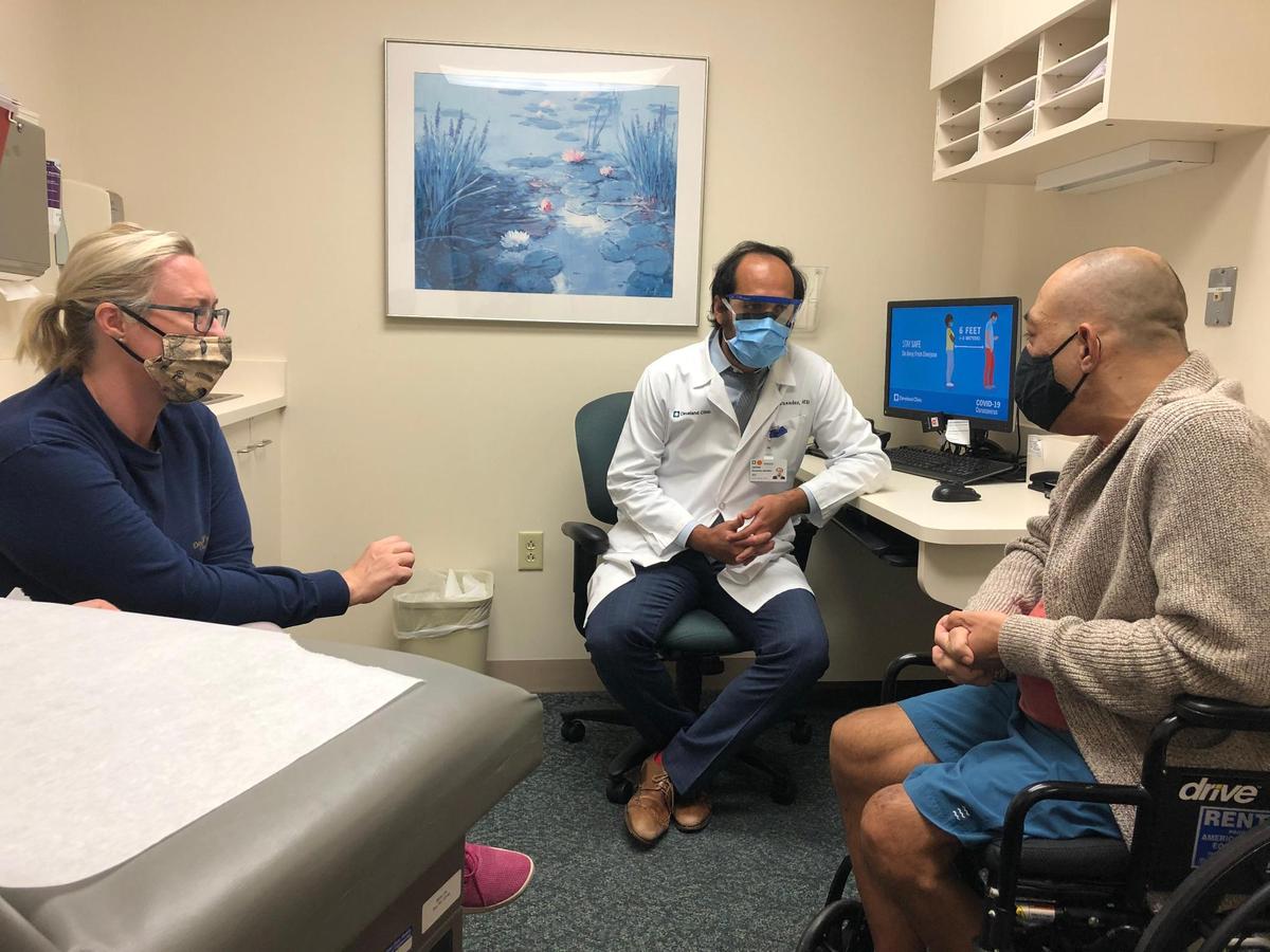  Dr. Jaime Hernandez-Montfort,&nbsp;specialist in advanced heart failure and transplant cardiology at Cleveland Clinic Weston, consults with his patient, Clayton Hernandez, on right. Cristina Hernandez, Clayton’s wife, listens.