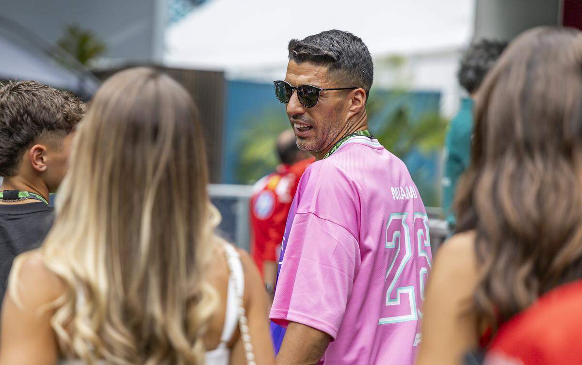 Inter Miami forward Luis Suarez (9) and his family visits the Scuderia Ferrari HP team village at the paddock during media day for the Formula One Miami Grand Prix at the Miami International Autodrome at Hard Rock Stadium on Thursday, April 30, 2026, in Miami Gardens, Fla.