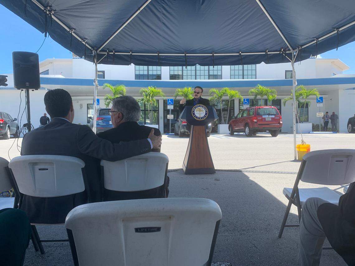 Miami Mayor Francis Suarez puts his arm around Commissioner Manolo Reyes while musician Frankie Marcos speaks during Monday’s press conference.
