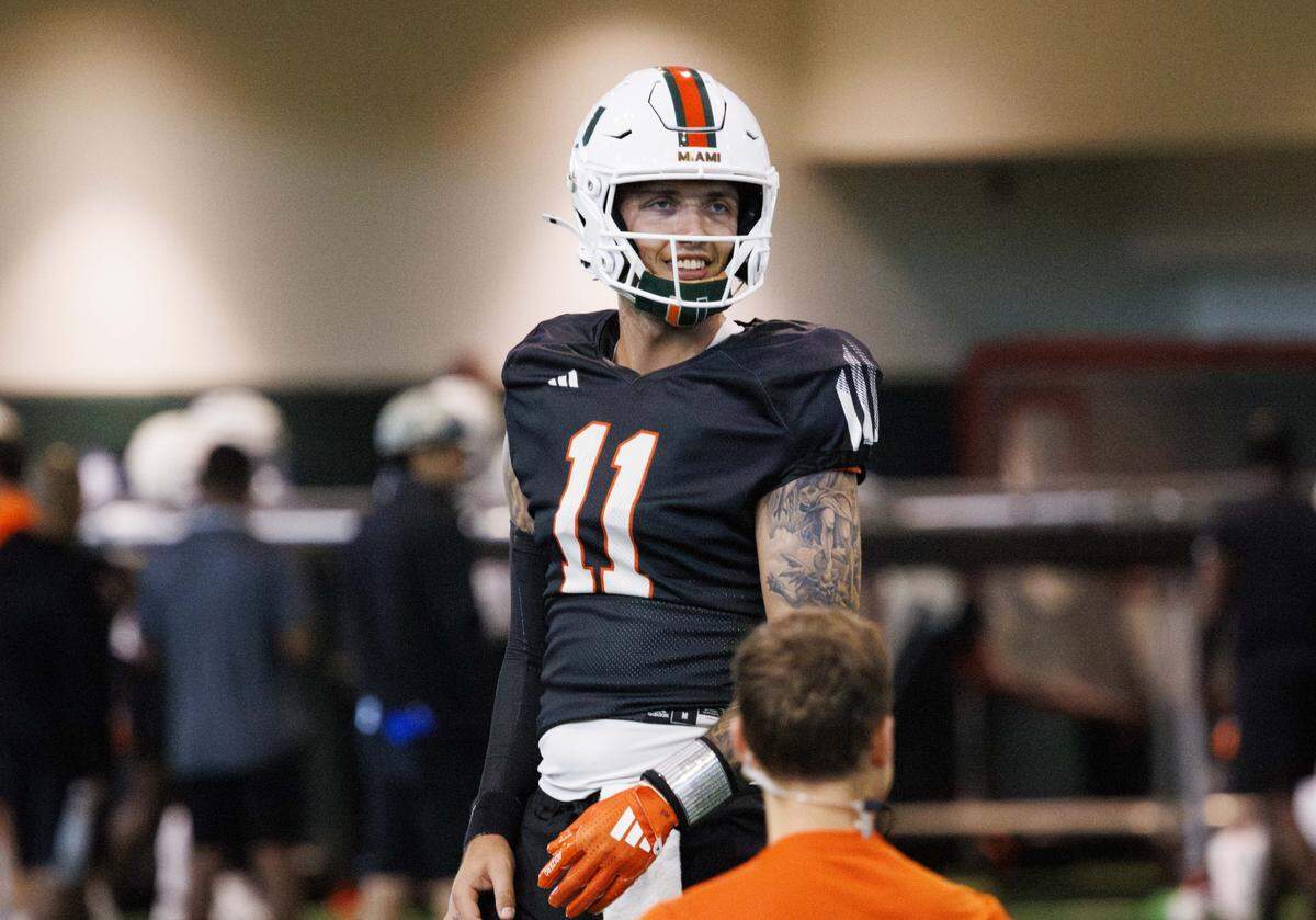 Quarterback Carson Beck (11) smiles during Miami Hurricanes football practice on Wednesday, Aug. 6, 2025, at University of Miami in Coral Gables, Fla. 