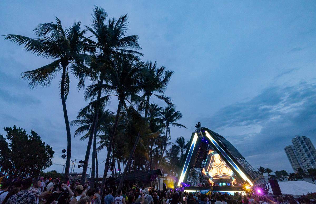 People gather to listen to a performance on one of Ultra Music Festivals stages during the show’s 25th anniversary at Bayfront Park on Saturday, March 29, 2025, in downtown Miami, Fla.