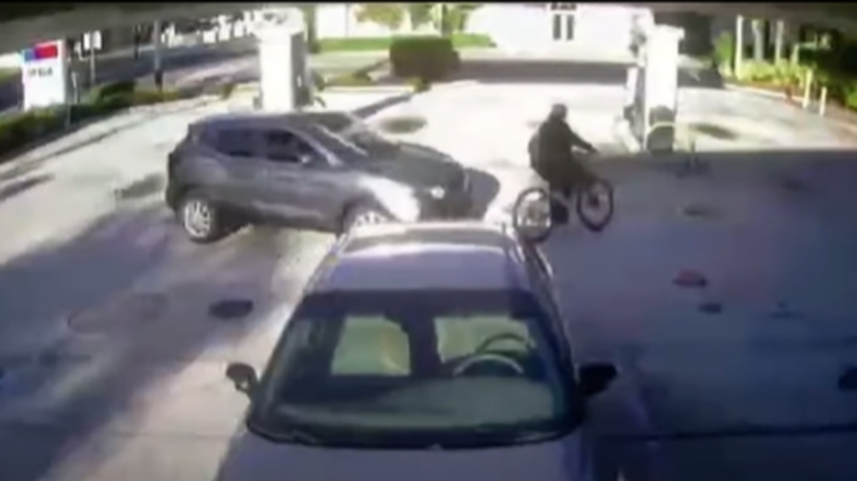 Surveillance video shows the dispute began just before 7 p.m. “when the teen nearly collided with a gray Nissan SUV in the parking lot of a gas station,” police said.