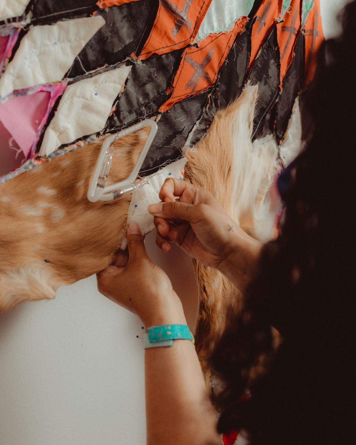 Artist Natalie Ball works on a piece of art at the Fountainhead Arts residency in Miami.