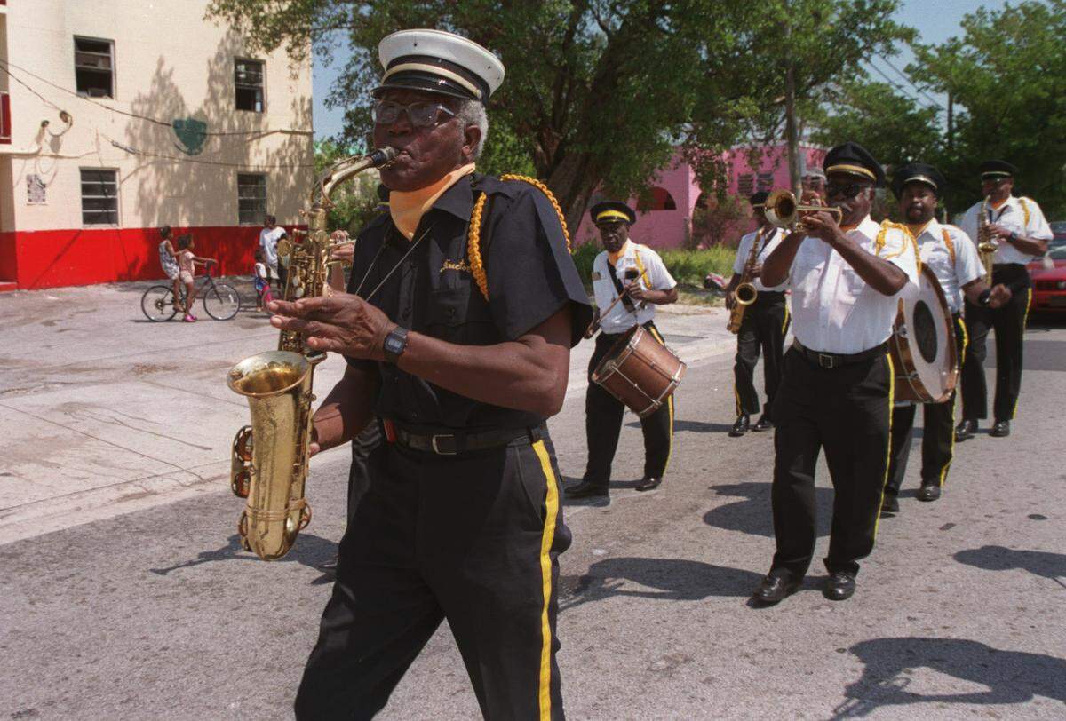 Charles Cash, director of the Cornet Progressive Band, leads the band to the City of Miami Cemetery from Historic St. Agnes Episcopal Church at 1750 NW Third Ave. The procession is an annual event to honor pioneer African-Americans buried in the cemetery.