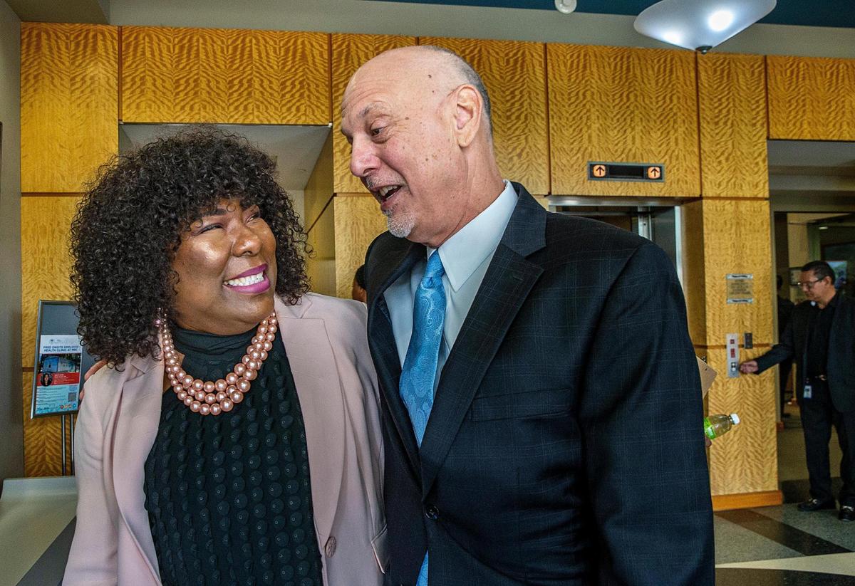 José Pañeda, the Spanish language voice (“La Voz”) of the Miami HEAT greets Gail Seay after her surprise rendition of the National Anthem during Mayor Francis Suarez’s State of the City address on Friday Jan. 27, 2023. Pañeda was the emcee of the event, and Seay stepped up to sing when the original singer didn’t appear.
