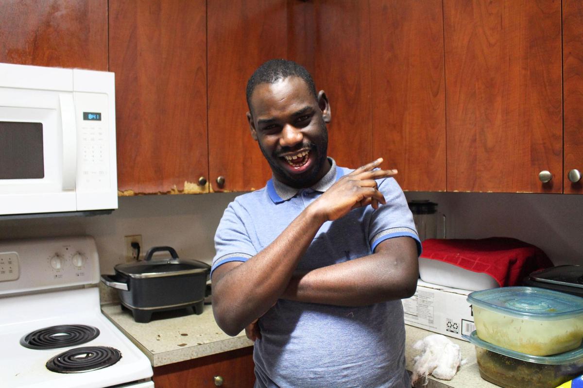 Clarens Philippe, 28, is speech-impaired and intellectually disabled. He needs a speech-generating device to help him communicate.