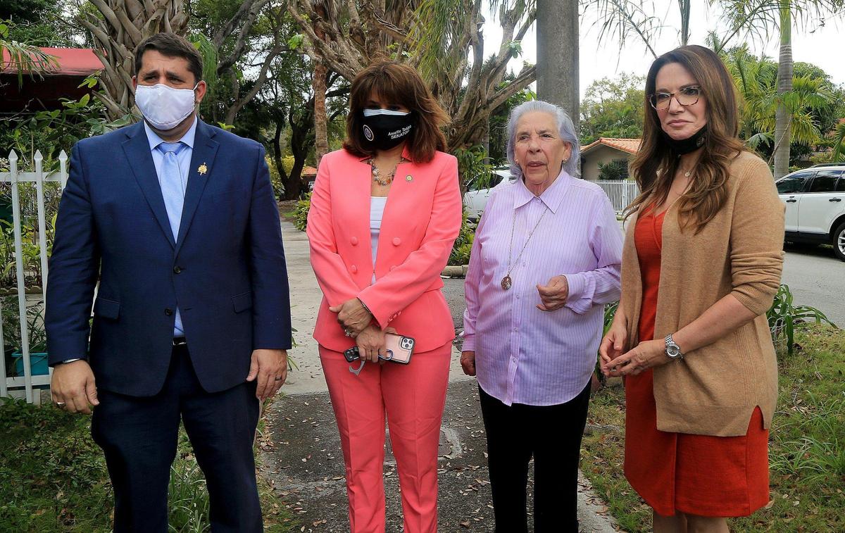 Attorney Bruce Jacobs, state Sens. Annette Taddeo (second from left) and Ileana Garcia (far right) joined together in support of Ana Lazara Rodriguez (second from right), who is an 82-year-old survivor of a Castro prison and lives in a home in Miami that the bank has foreclosed on.