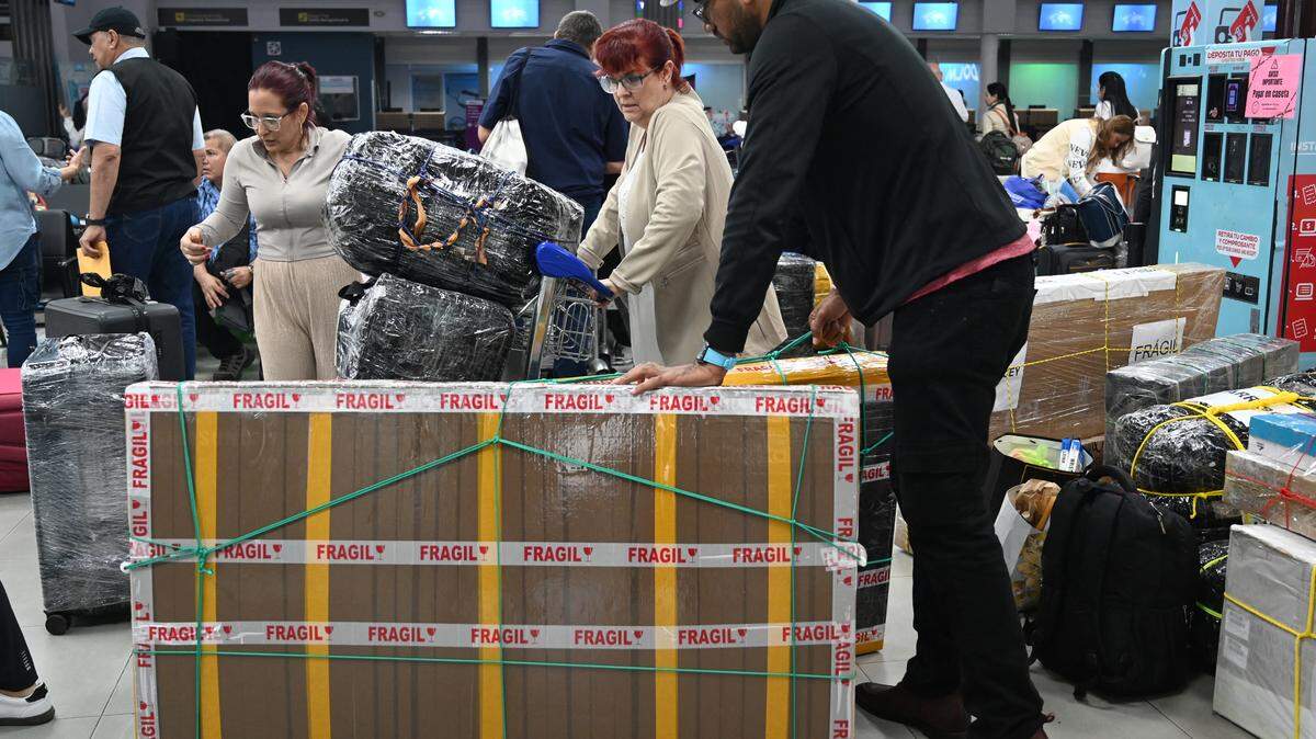 A Cuban doctor arrives at Ramon Villeda Morales airport in San Pedro Sula, Honduras on March 5, 2026. Some 128 Cuban doctors left Honduras after the agreement under which they had been operating for the past two years was not renewed by the government of conservative President Nasry Asfura, aligning itself with US plans to reduce the flow of foreign currency to Cuba.