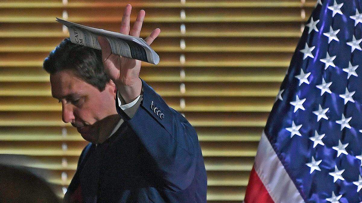 Gov. Ron DeSantis waves after a bill signing of legislation impacting the state’s colleges and universities on May 15 at Sarasota’s New College of Florida.