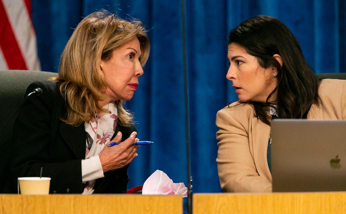 Miami-Dade Public Schools board member Dr. Marta Pérez, left, talks with member Christi Fraga during a special meeting on Tuesday, Jan. 18, 2022. Fraga and Pérez are pushing back over board member Lucia Baez-Geller’s proposal to recognize October as LGBTQ month in Miami-Dade Schools and to incorporate two landmark Supreme Court decisions into the teaching materials for 12th-grade students.