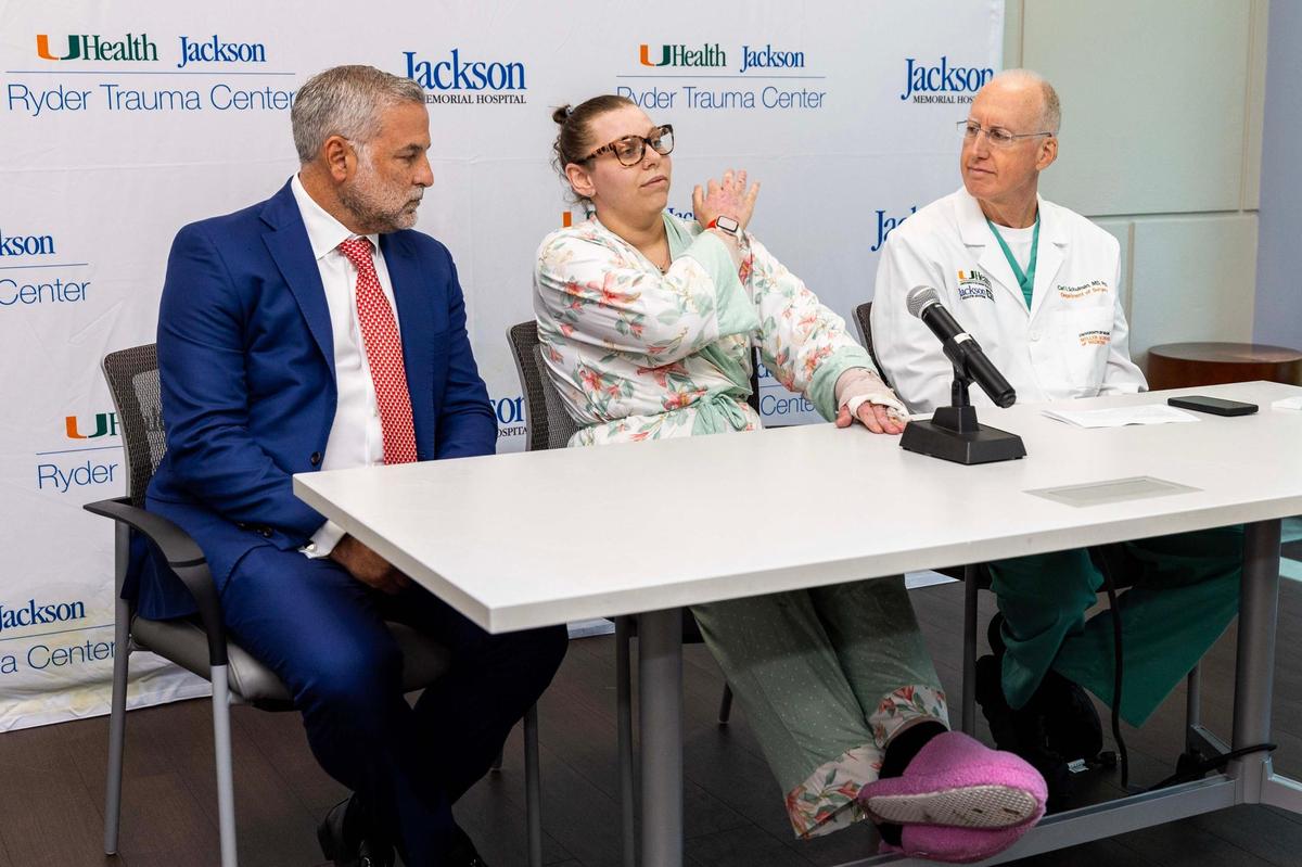 From left to right, attorney Glen Levine, burn victim Cassandra Rivera and Dr. Carl Schulman, a burn expert at Jackson Memorial Hospital, speak to the media about the boat explosion off Fort Lauderdale on Memorial Day, at Ryder Trauma Center at Jackson Memorial Hospital on Wednesday, June 11, 2025, in Miami, Fla. Eleven of the 15 passengers were hospitalized and the 29-year-old boat operator was killed.