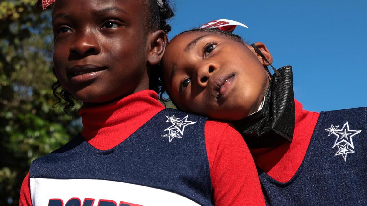 Agenoria S. Paschal / Olinda Elementary School second-graders Tamera Green, 8, left, and Serenity Spain, 8, who are also cousins, take a pause from parade practice at the 45th Annual MLK Parade in Liberty City in 2022. This year’s parade will start at 11 a.m. Monday, Jan. 16.