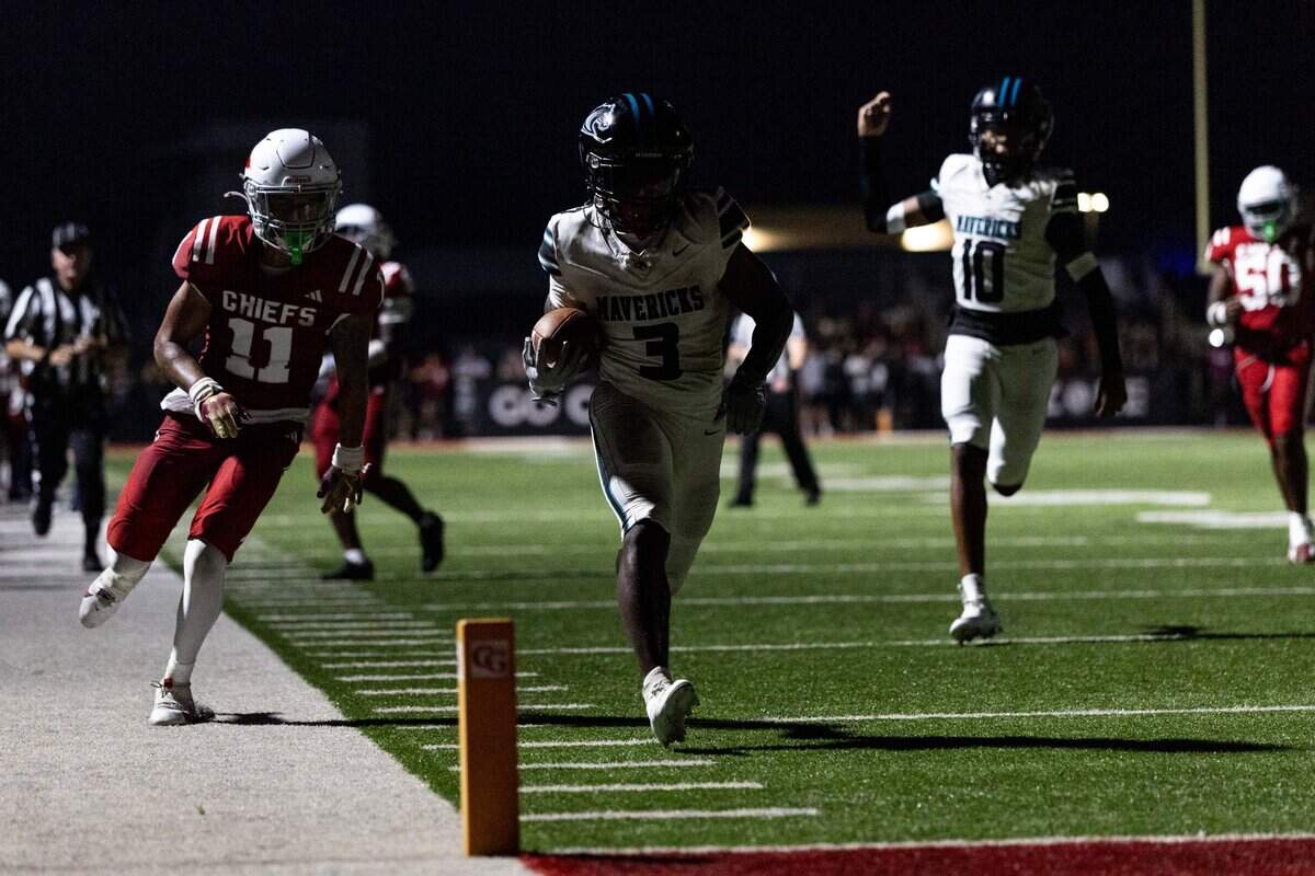 Archbishop McCarthy running back Damien Grant (3) scores a touchdown as Cardinal Gibbons cornerback Jayden Thomas (11) looks on during a football game on Thursday, August 21, 2025, in Fort Lauderdale, Fla.