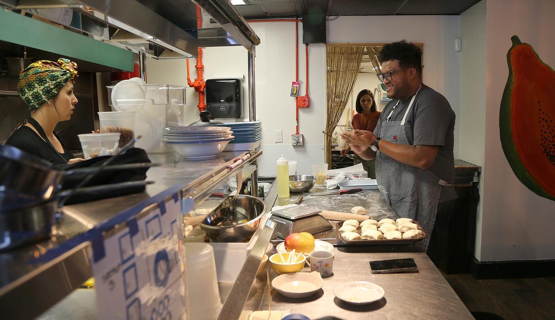 Chefs Melissa Sosa and Timon Balloo work the kitchen at Timon’s new Balloo: Modern Home Cooking.