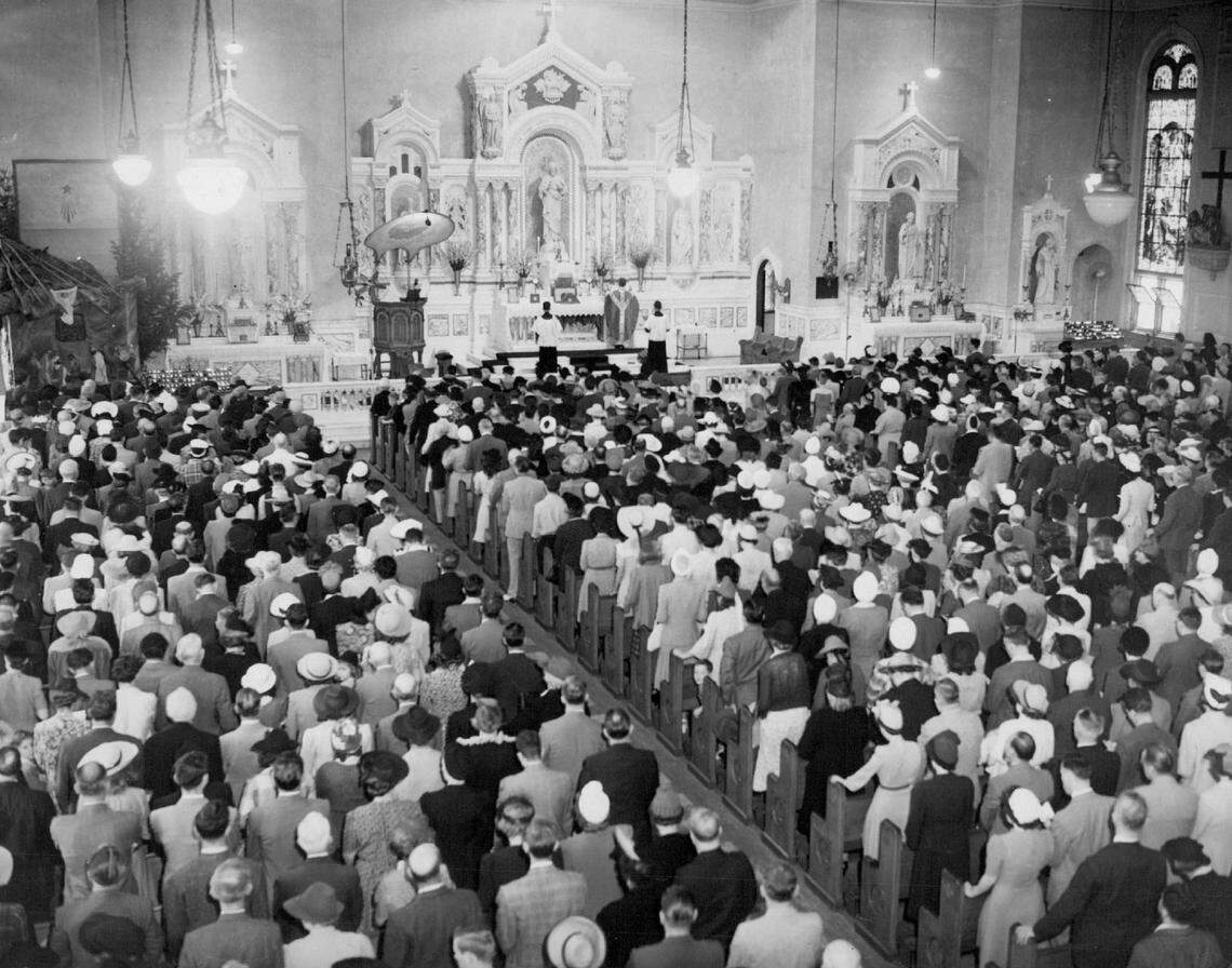 Photo shows crowd at Gesù Catholic Church in this Herald archive photo.