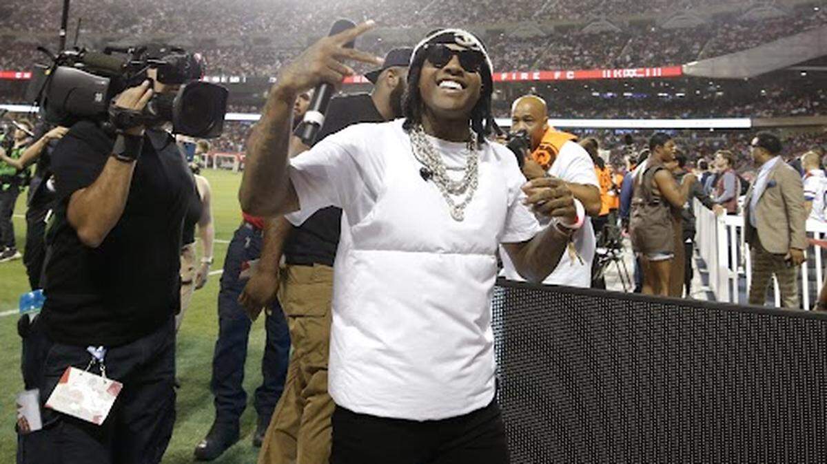 Oct 4, 2023; Chicago, Illinois, USA; Rapper and singer Lil Durk gestures during halftime of the game between the Chicago Fire and Inter Miami CF at Soldier Field. Mandatory Credit: Jon Durr-USA TODAY Sports
