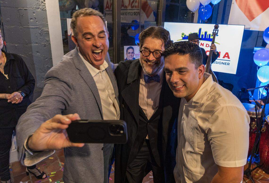 Little Havana businessman William “Bill” Fuller (far left) and attorney J.C. Planas (center) celebrated Rolando Escalona’s victory after he defeated Frank Carollo during the runoff election for District 3 at a party celebrated at the Tower Hotel owned by Fuller, on Tuesday, Dec. 9, 2025. 
