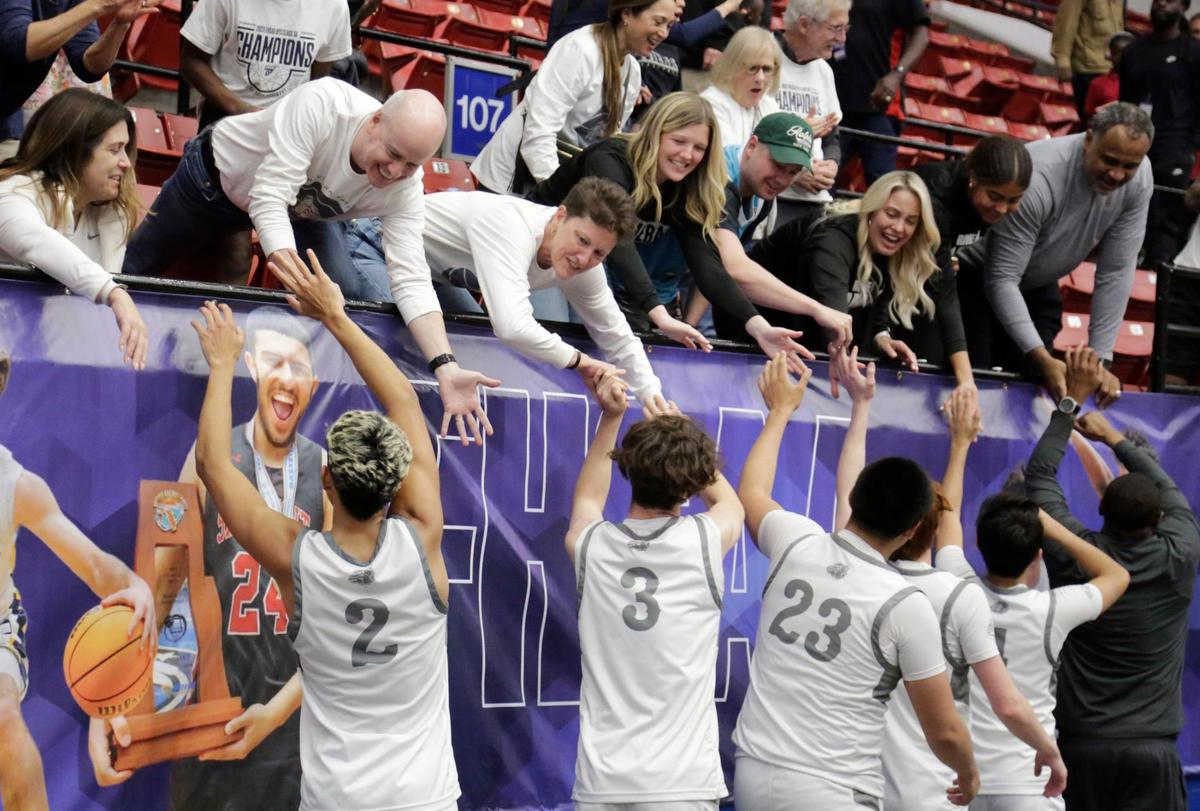 The Bulldogs celebrate with the fans, students and family after winning the 3A State Championship. Riviera Prep defeated the Windermere Prep 68 to 57 to earn back to back state titles. Fhsaa 2024 State Championships Lakeland, Fl. March 1st 2024. Special to the Miami Herald / Calvin Knight.