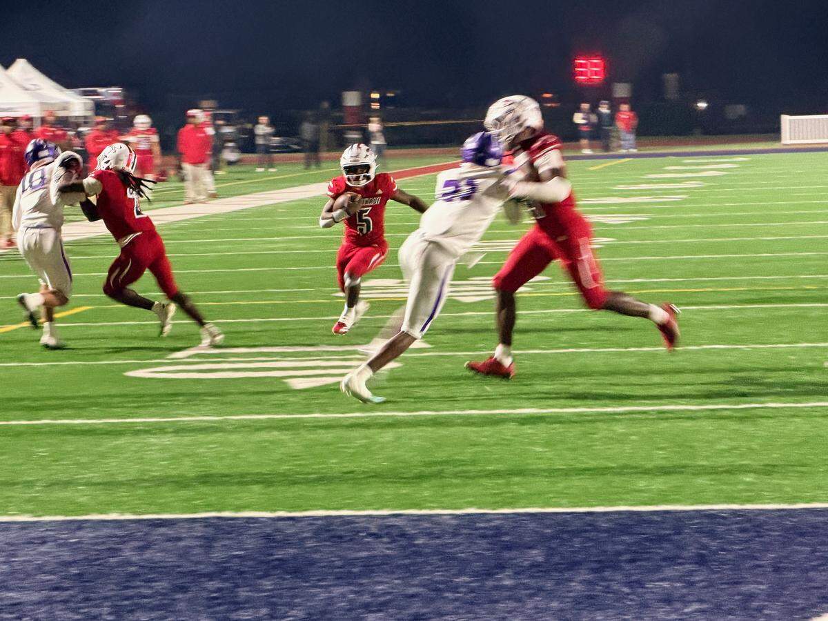 Junior running back Lee Price Jr. (No. 5) scores the second of his two fourth quarter touchdowns for Chaminade-Madonna during Friday’s Region 4-1A championship game in Hollywood, Fla.