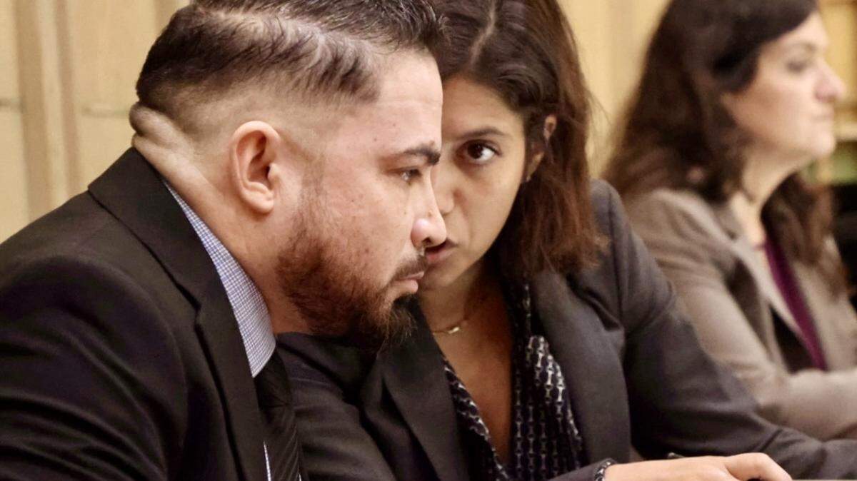 Daniel Ramos-Aviles, left, Miami-Dade cop who is accused of sexually abusing children, appears with his attorneys Scott Kotler and Natalie Lopez, right, during the closing arguments of his trial presided over by Judge Marisa Tinkler Mendez in the Courtroom 4-6 at the Richard E. Gerstein Justice Building on Wednesday, September 3, 2025, in Miami, Florida.