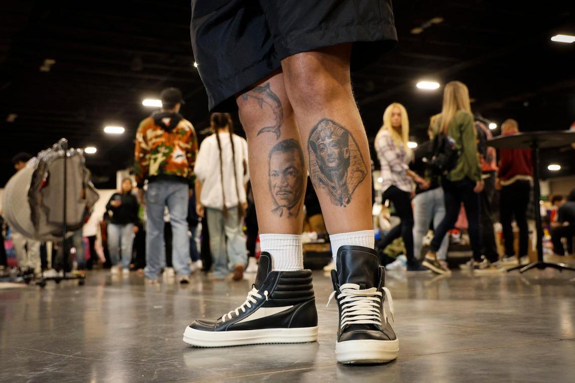 Token Miami founder Myrick Mitchell shows off his Rick Owens sneakers during Sneaker Con at the Broward County Convention Center in Fort Lauderdale, Florida, on Saturday, Jan. 11, 2025.