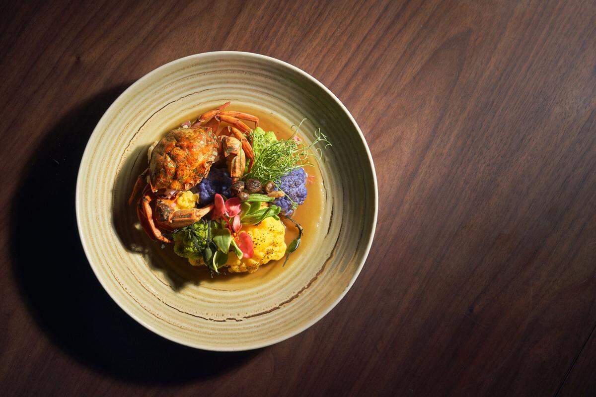 Chef Scott Linquist, who designed the menu for Hidden Worlds Miami, calls this dish the “vibrant coral reef.” It features an invasive species of crab, curry made with crab meat and seasonal vegetables to replicate a coral reef.