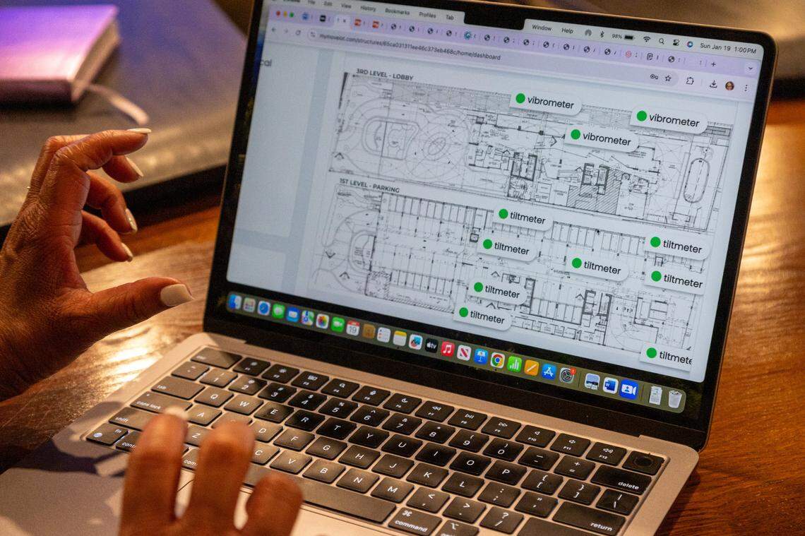 Lisa Gardner, president of the condominium association at the Marenas Beach Resort, shows how she monitors the innovative SmartCore sensor system set up around the building that detect motion on Jan.19.