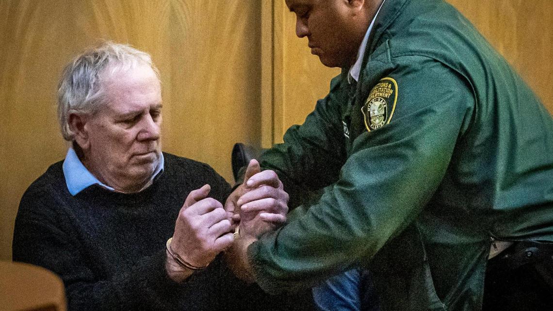 Miami, FL- January 25, 2023 - A Dept. of Corrections officer handcuffs Robert Koehler after he was found guilty on all counts at the Richard E. Gerstein Justice Building.