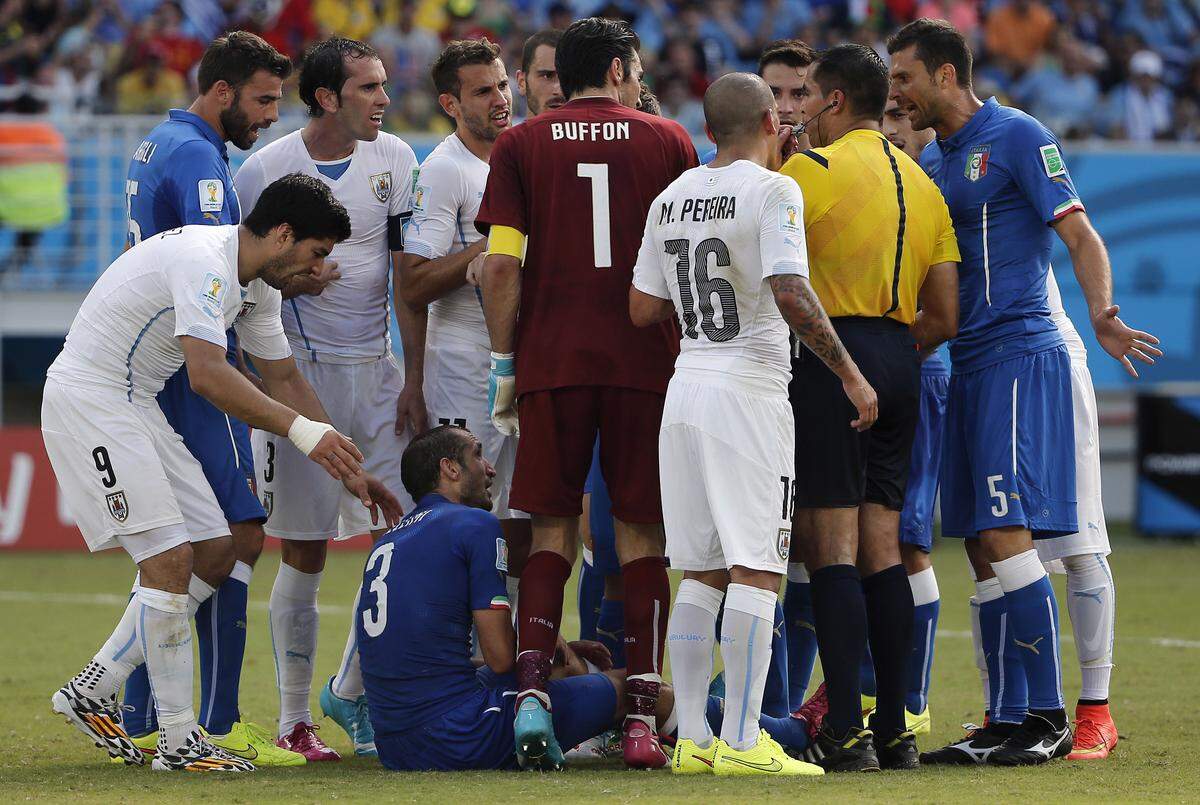 Jun 24, 2014; Natal, Rio Grande do Norte, BRAZIL; Uruguay forward Luis Suarez (9) moves in to try to talk with Italy defender Giorgio Chiellini (3) after he allegedly bit him during the second half of Uruguay's 1-0 win over Italy in a 2014 World Cup game at Estadio das Dunas. Mandatory Credit: Winslow Townson-USA TODAY Sports
