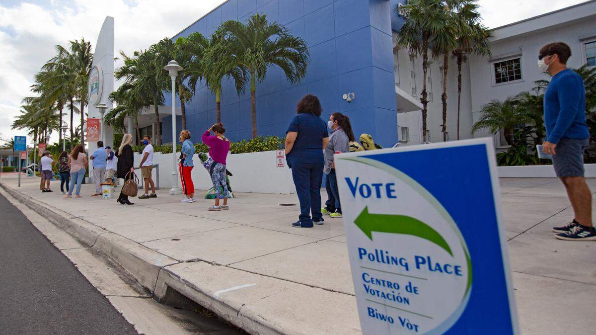 People stand on line to vote during the General Election in Miami-Dade County at Surfside Town Hall on Tuesday, November 3, 2020 in Surfside.