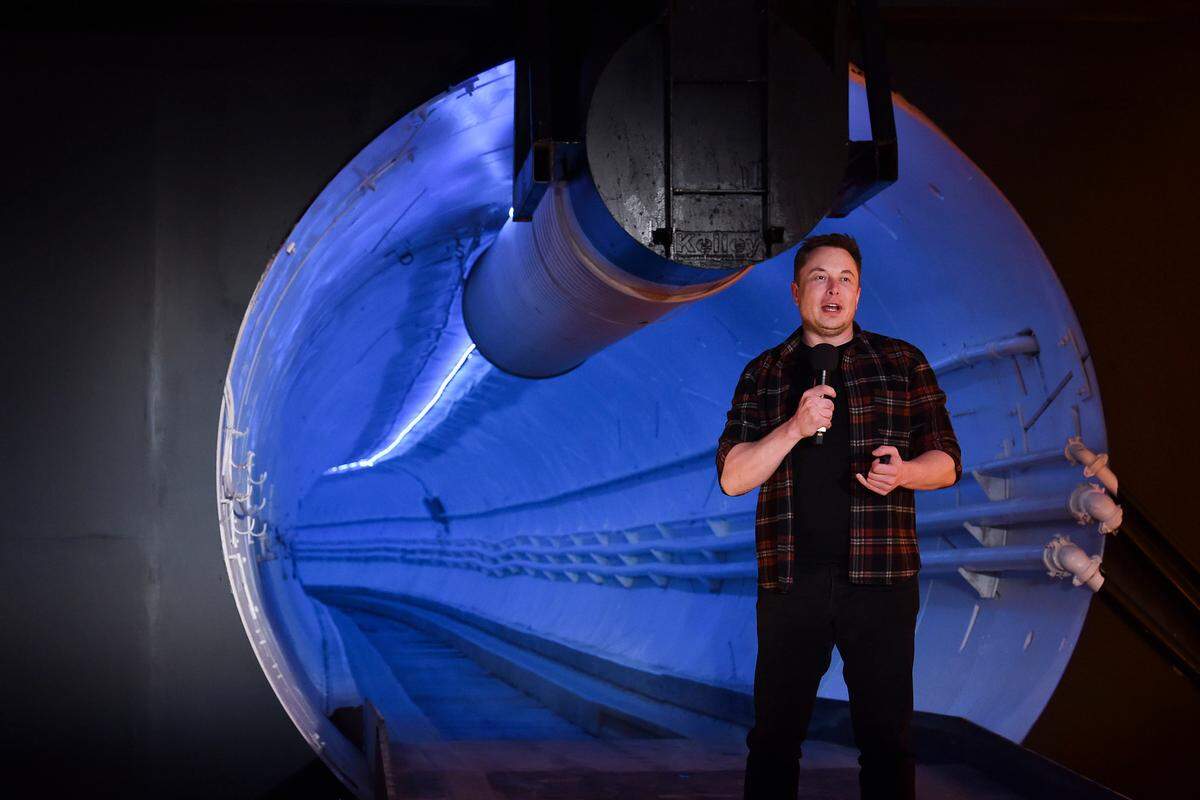 Elon Musk, co-founder and chief executive officer of Tesla Inc., speaks during an unveiling event for the Boring Co. Hawthorne test tunnel in Hawthorne, Calif., on Tuesday, Dec. 18, 2018. Musk unveiled his underground transportation tunnel, allowing invited guests to take some of the first rides ever on the tech entrepreneur’s solution to “soul-destroying traffic.”