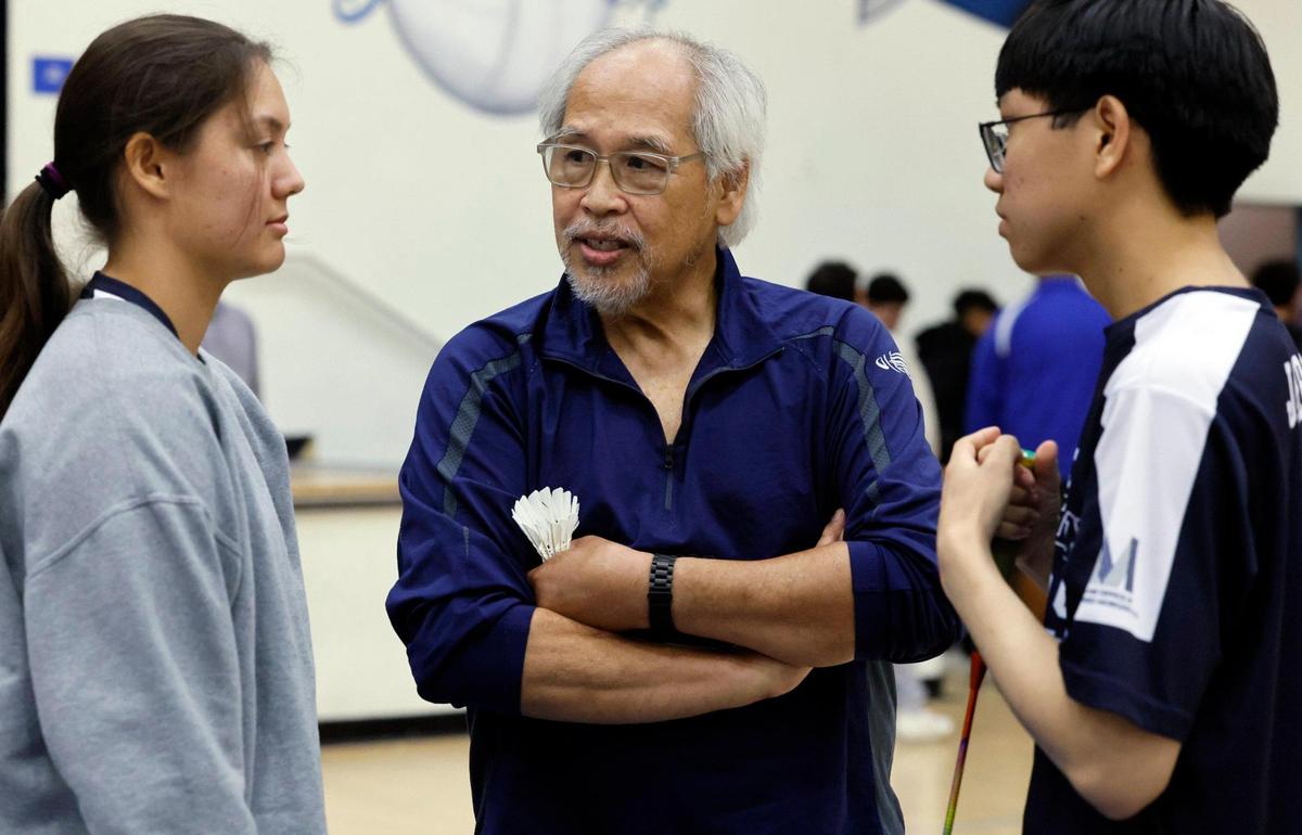 Miami Palmetto High School’s badminton coach David Zarco speaks with athletes Katarina Slazas, at left and Frederick Landsea, at right, during the Greater Miami Athletic Conference badminton finals at Braddock High School in Miami, Florida on Wednesday, April 23, 2025.