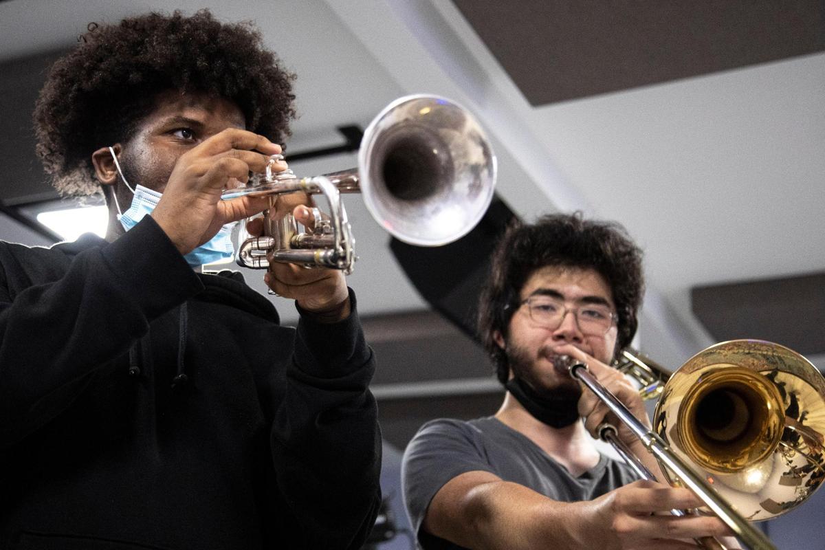 Jazz Collective trumpet player Gabriel Johnson, left, and trombonist Andre Perlman rehearse at the Wynwood School of Music in Miami. The students are part of the Young Musicians Unite program.