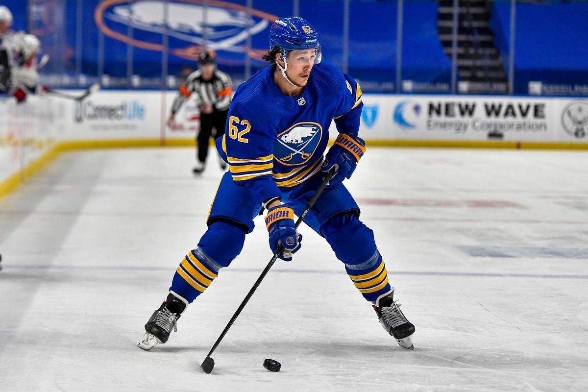 Buffalo Sabres defenseman Brandon Montour (62) skates with the puck during the second period of an NHL hockey game against the New York Rangers in Buffalo, N.Y., Thursday, April 1, 2021. (AP Photo/Adrian Kraus)