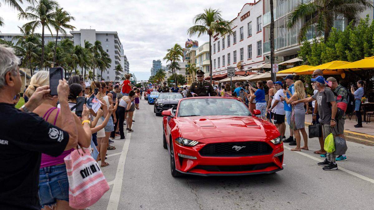 City officials drive down Ocean Drive with veterans in tow during the 16th Annual Veterans Day Parade on Monday, Nov. 11, 2024, in Miami Beach, Fla.
