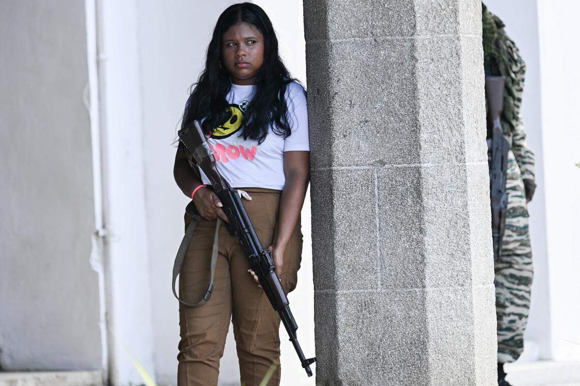 A member of the Bolivarian National Militia holds a rifle during a military training in La Guaira, Venezuela, on Oct. 8, 2025.  