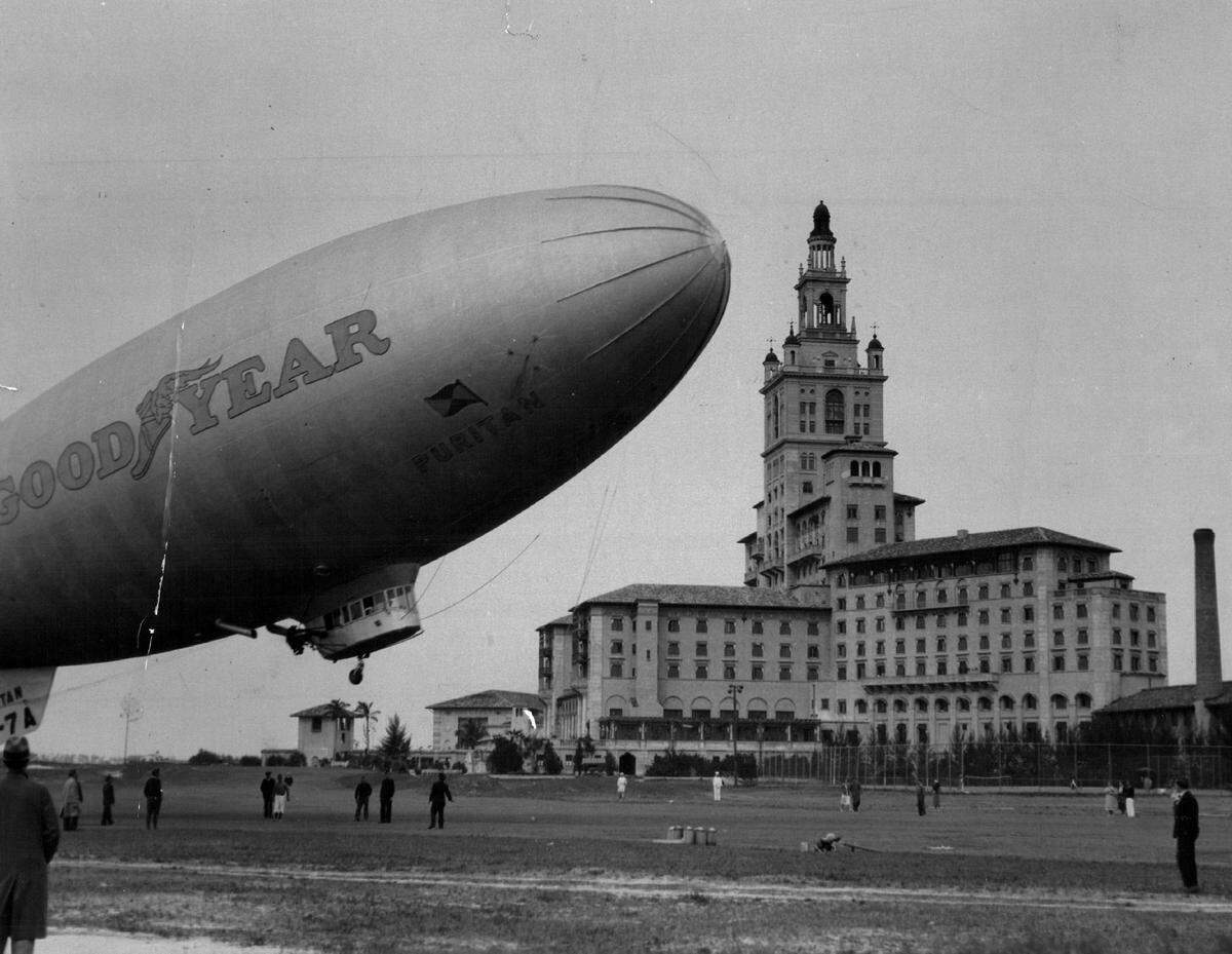 The Goodyear blimp Puritan leaves the Biltmore in Coral Gables after picking up two couples who had been playing golf there in 1964.