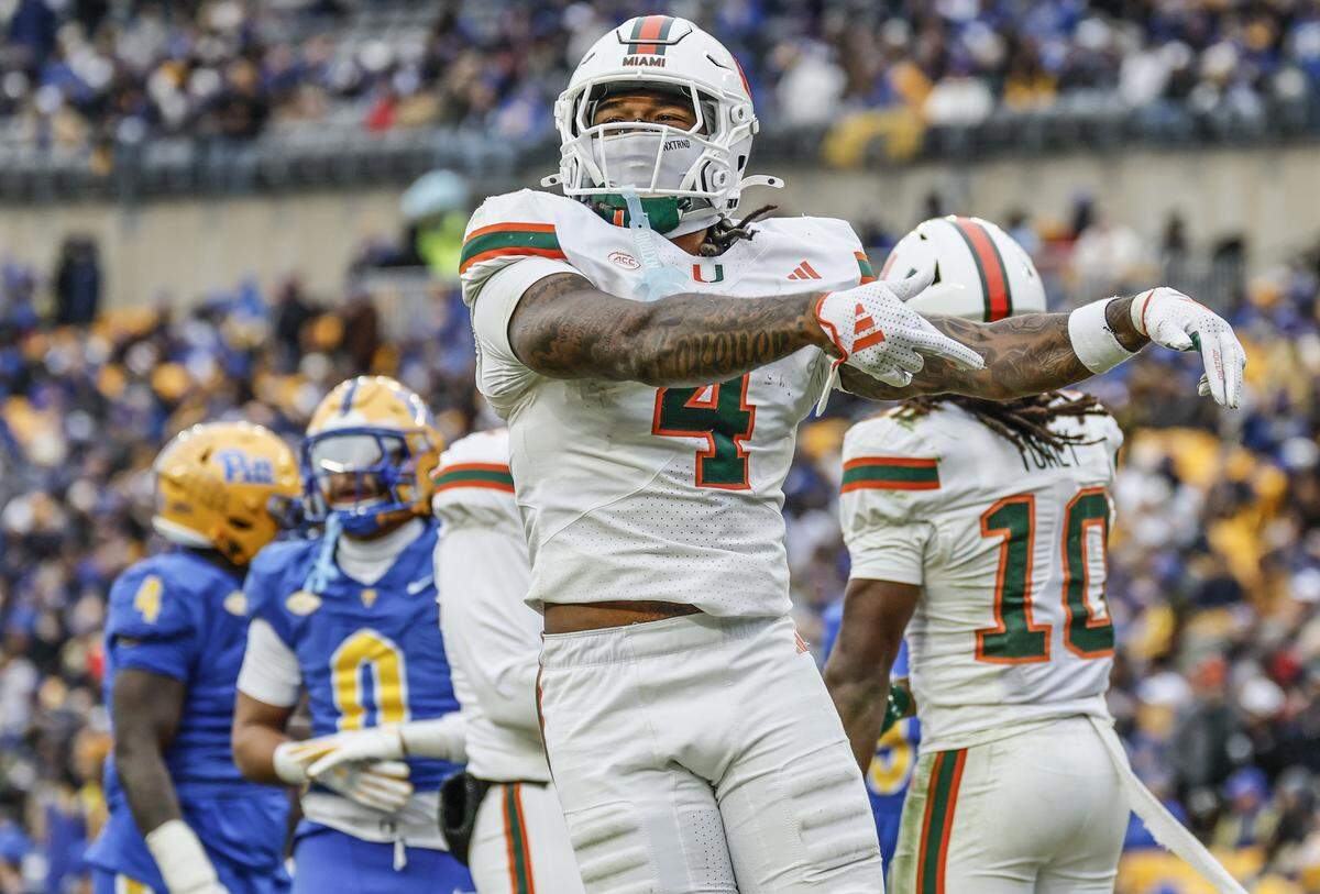 Miami Hurricanes running back Mark Fletcher Jr. (4) celebrates in the endzone after wide receiver Malachi Toney (10) scores on a pass reception during the first half against the Pittsburgh Panthers during their NCAA football game at Acrisure Stadium in Pittsburgh, PA, on Saturday, November 29, 2025.