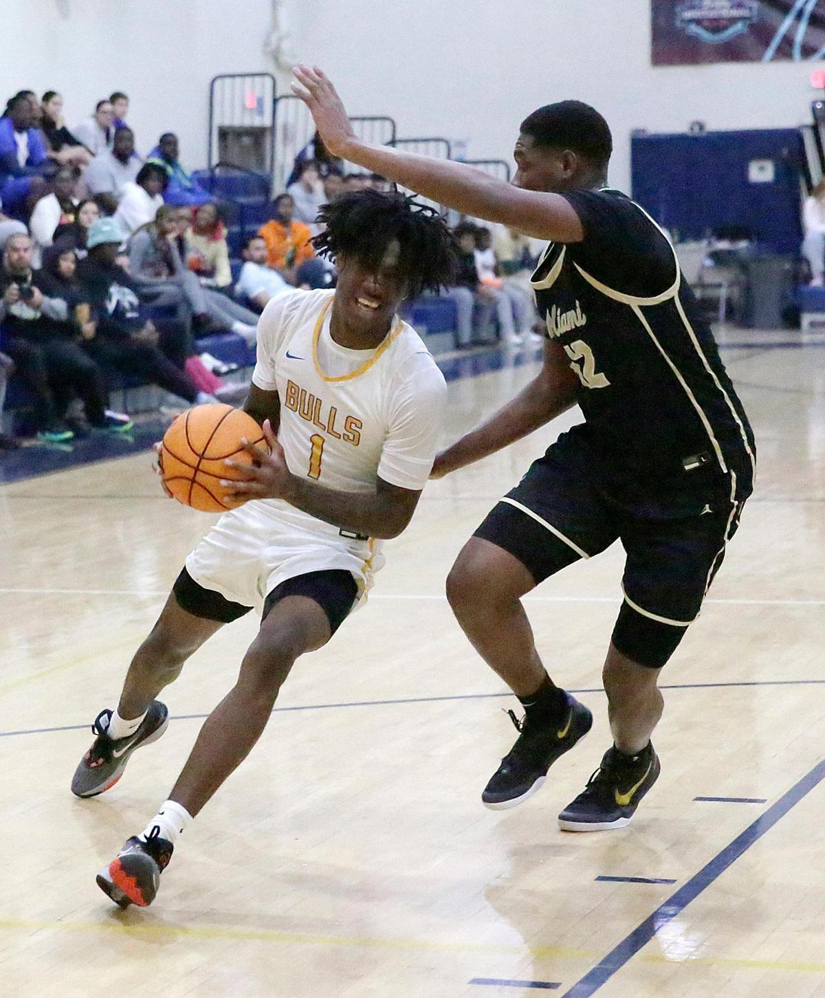 Northwestern Calvin Russell Jr. (1) controls the ball during the GMAC Boy’s championship basketball game against Miami Senior High Saturday, January 25, 2025 at Miami Senior HS in Miami. Andrew Uloza / for Miami Herald